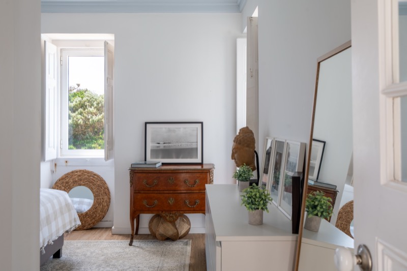 Bedroom with king-size bed, antique chest and original shuttered windows