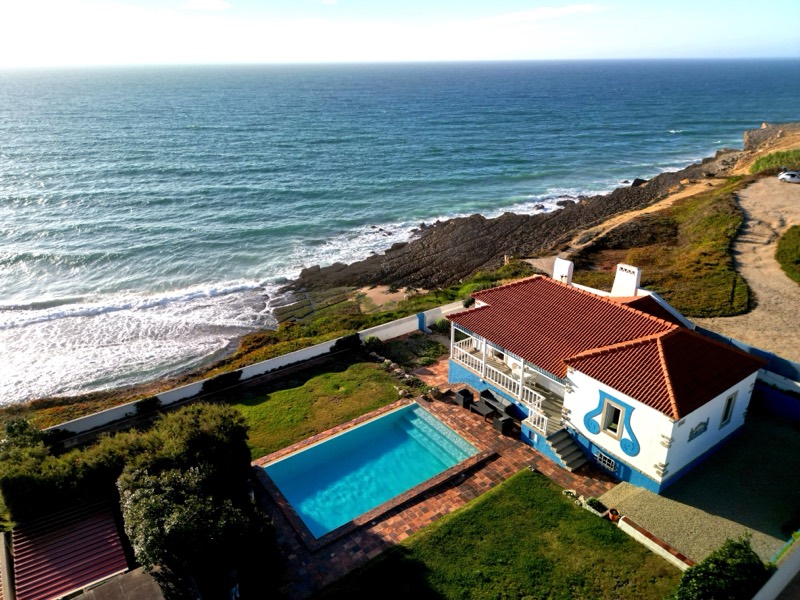 Aerial view of the villa, the cliff and the Atlantic breaking on the rocks