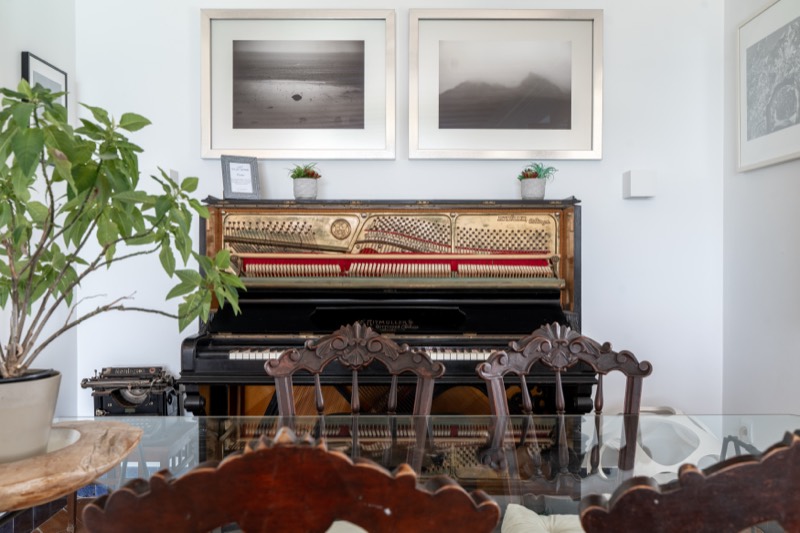 Restored 1907 upright piano with its mechanism exposed